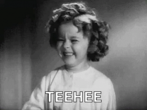 Little Girl Laughing in Black and White Saying Teehee