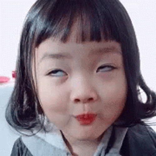 Little Girl Making Funny Face Eyes Closed GIF