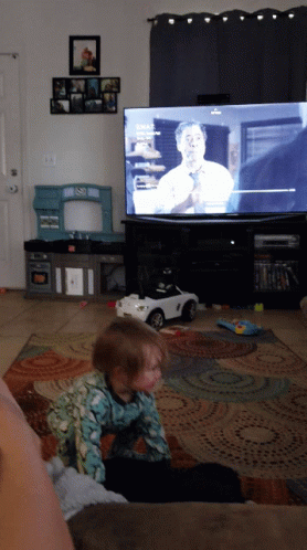 Little Girl on Couch Watching Fox News