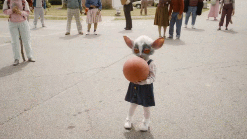 Little Girl Playing Basketball In Front Of Crowd GIF