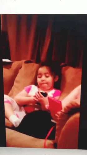 Little Girl Playing With Red Tablet GIF