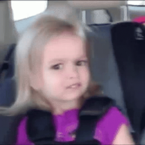 Little Girl Sitting in Car Seat With Seat Belt