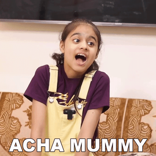 Little Girl Sitting On Couch Mouth Open Acha Mummy GIF