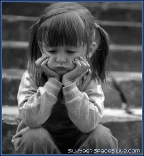 Little Girl Sitting on Stairs Hands on Chin
