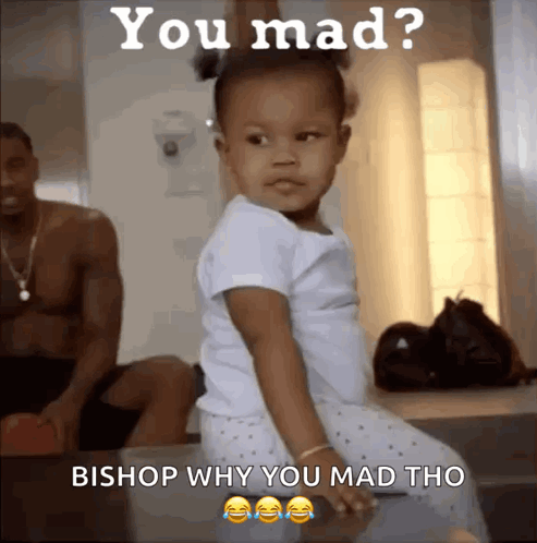 Little Girl Sitting on Table Saying You Mad