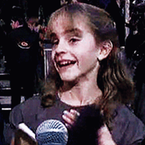 Little Girl Smiling Holding Microphone