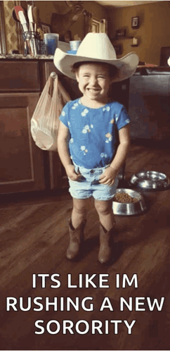 Little Girl Smiling in Cowboy Hat and Shorts