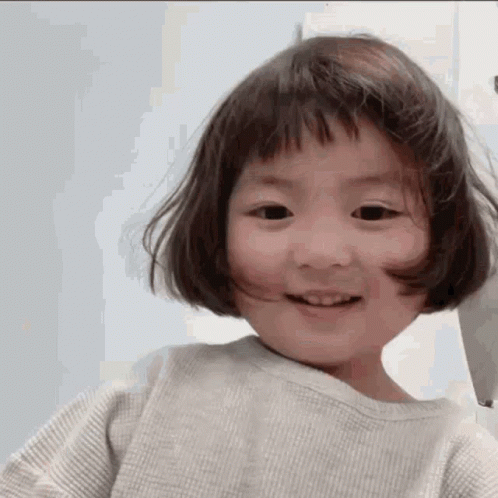 Little Girl Smiling With Short Hair And Bangs GIF