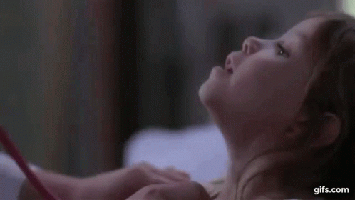 Little Girl Sticking Tongue Out Looking GIF