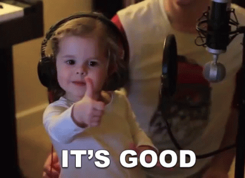 Little Girl Thumbs Up With Headphones and Microphone