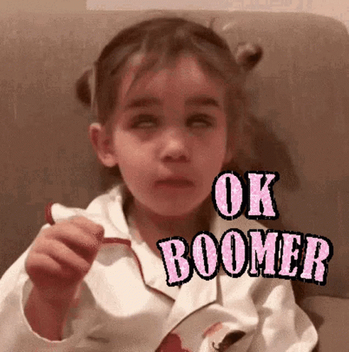 Little Girl Wearing White Jacket With Ok Boomer