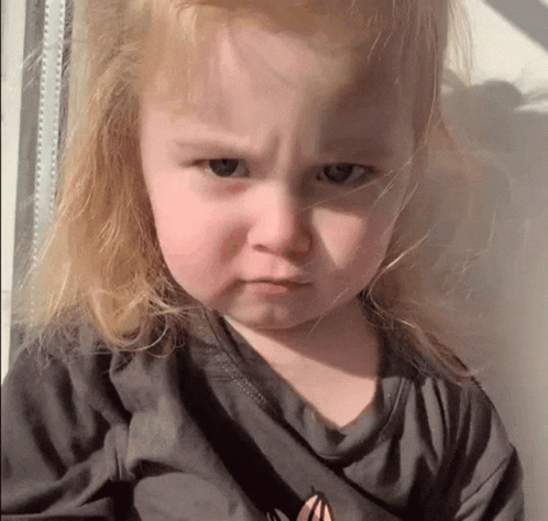 Little Girl With Blonde Hair Making Funny Face GIF