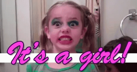 Little Girl With Makeup Making Funny Face In Mirror GIF