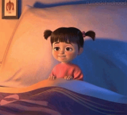Little Girl With Pigtails Lying in Bed