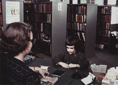 Little Kid Borrows Book Library GIF