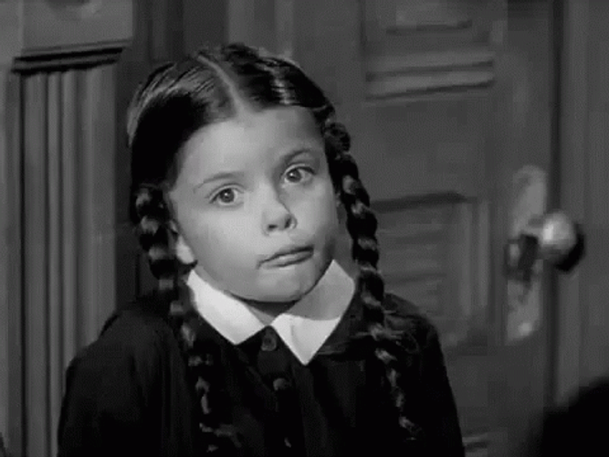 Little Wednesday Addams Shrugging Shoulder GIF
