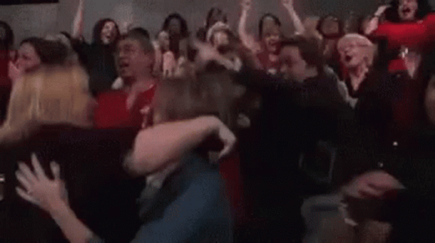 Lively Crowd Cheering And Hugging GIF