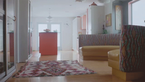 Living Room With Rug And Yellow Couch GIF