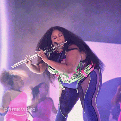 Lizzo Pink Flute Spotlight GIF