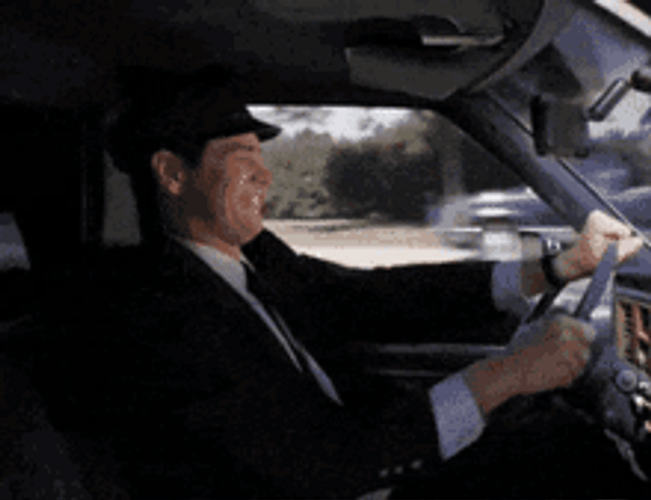 Lloyd Christmas Jim Carrey Driving Car Got Worms GIF