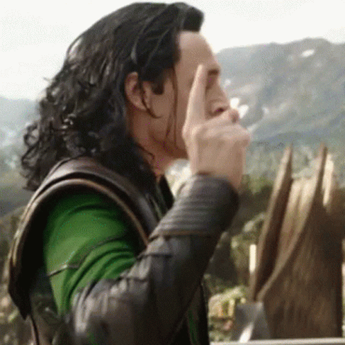 Loki From Avengers : Age Of Ultron Is Covering His Face With His Hand . GIF