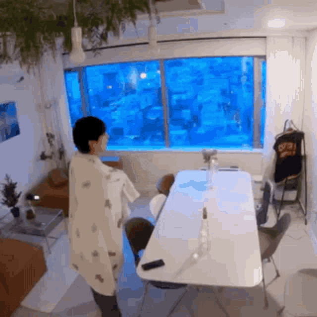 Lonely Boy Looking Around His Apartment GIF