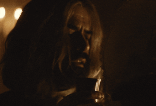 Long Hair Beard Man Looking Down in Dark