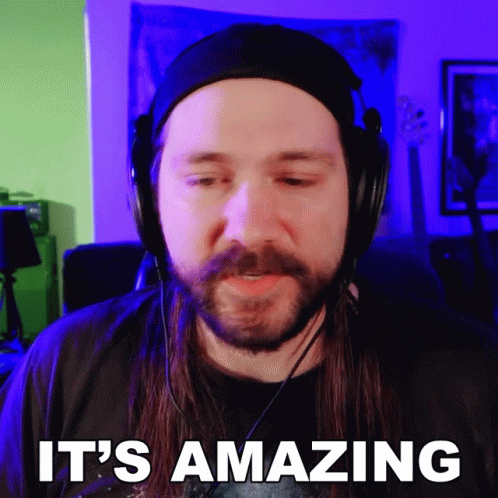 Long Haired Beard Man Headphones Saying It's Amazing