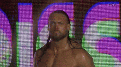 Long Haired Bearded Man In Front Of Fits Screen GIF