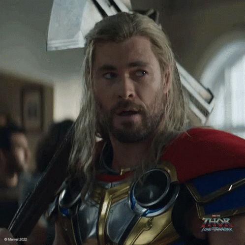 Long Haired Bearded Man in Superhero Costume