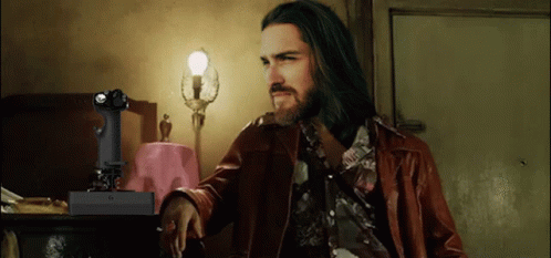 Long Haired Bearded Man With Remote Saying X