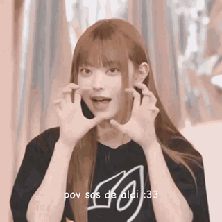 Long Haired Girl Making Face with Hands Black Shirt