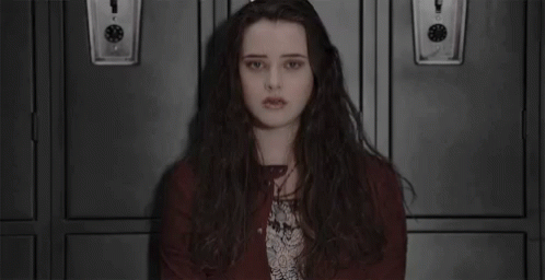 Long-Haired Girl Sitting In Front Of Lockers GIF