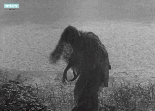 Long Haired Lady Spinning Around Monsoon Rain GIF
