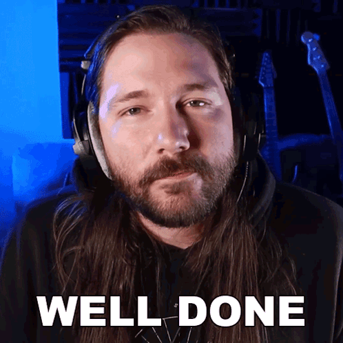 Long Haired Man Headphones Saying Well Done