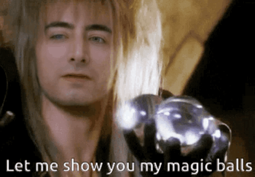 Long-Haired Man Holding Glass Ball Says Magic Balls GIF