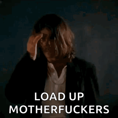Long-Haired Man Holding Gun Says Load Up Motherfuckers