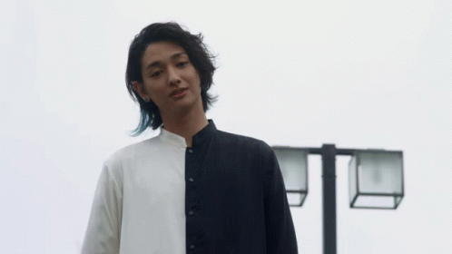 Long-Haired Man in Black and White Shirt