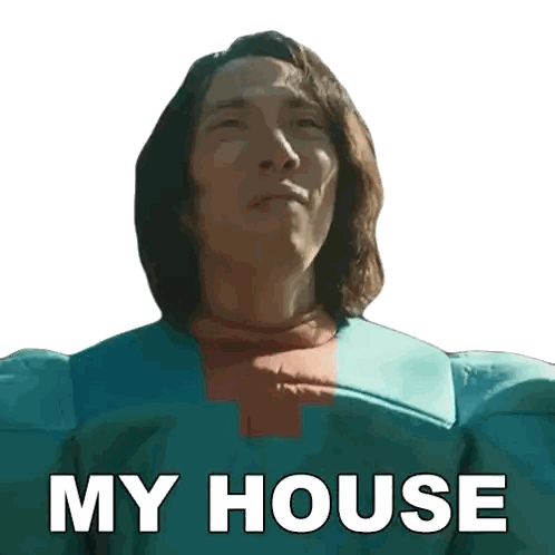 Long Haired Man in Blue Cross Shirt Saying My House