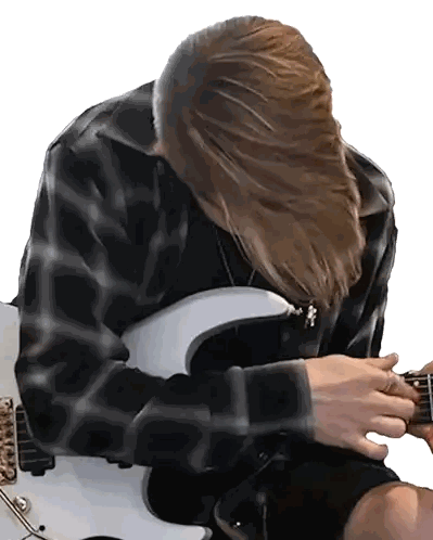 Long-haired Man Playing Guitar