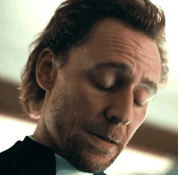Long Haired Man With Beard Eyes Closed Looking Down GIF