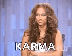 Long Haired Woman Arms Crossed In Chair Karma GIF