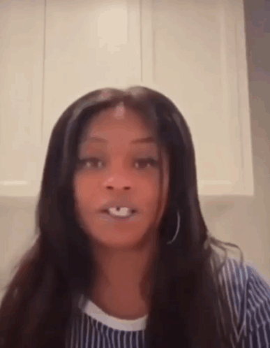 Long-Haired Woman Making Funny Face in Striped Shirt