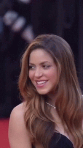 Long-Haired Woman Smiling On Red Carpet GIF
