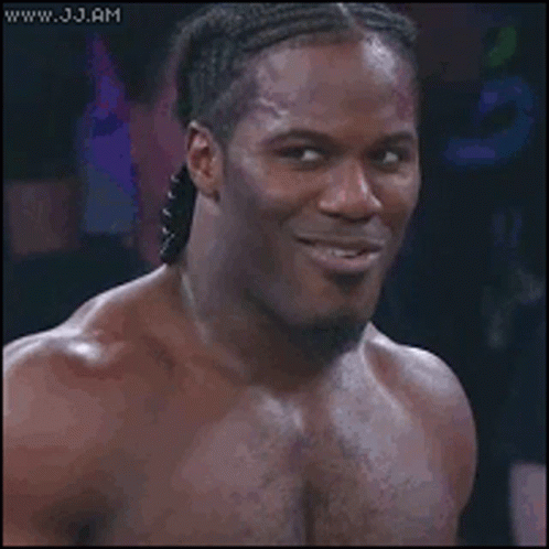 Long Haired Woman Smiling With Man Behind GIF