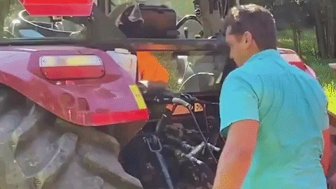 Looking At Tractor's Engine GIF
