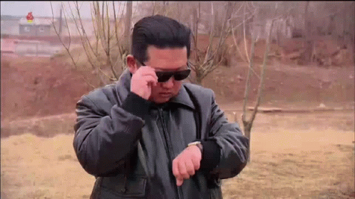Looking At Watch Kim Joong Un Sunglasses GIF