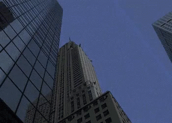 Looking Up At A Tall Building With A Sign That Says ' Chicago ' GIF