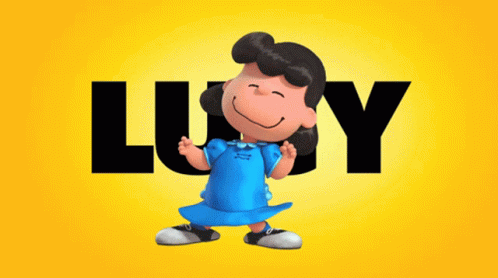 Lucy From The Peanuts Movie Stands In Front Of A Yellow Background GIF