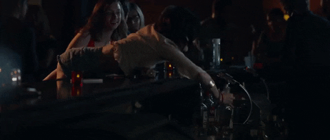 Lucy Hale Snatching Drinks From Bar GIF